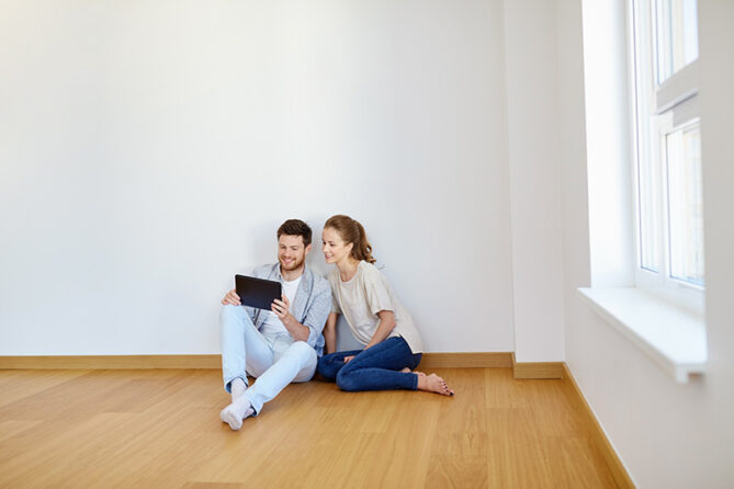 happy couple on empty room